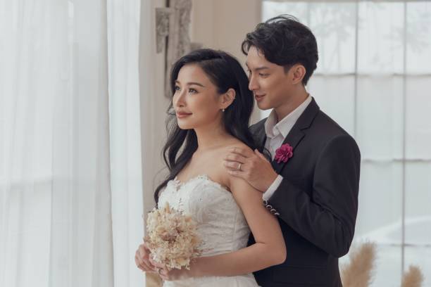 istock Romantic Bride and Groom Embracing on Their Wedding Day 2164276442