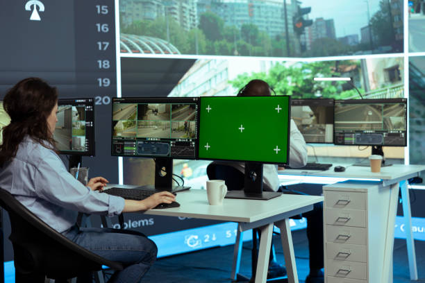 istock Operator monitors traffic next to an isolated mockup display 2164277878
