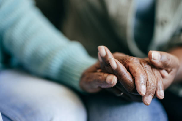 istock Young holding elderly hands for care and love 2164279351