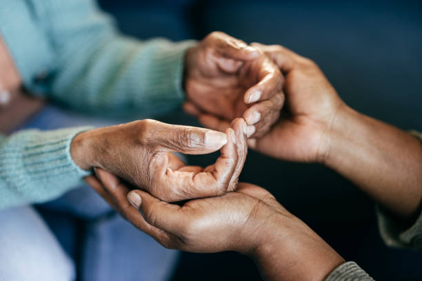 istock Young woman holding elderly hands 2164279352