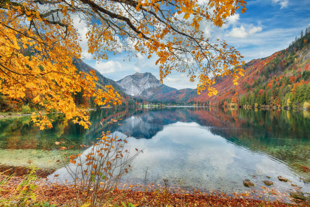 Captivating autumn scene of Vorderer Langbathsee lake.