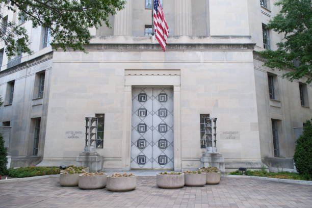 United States Department of Justice building, Washington, DC Exterior wall and entrance to the US Department of Justice building in downtown Washington, DC campaign headquarters stock pictures, royalty-free photos & images
