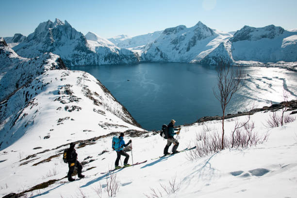 istock Top view of three skiers stopped on the slope while skiing and looking thoughtfully 2164281661