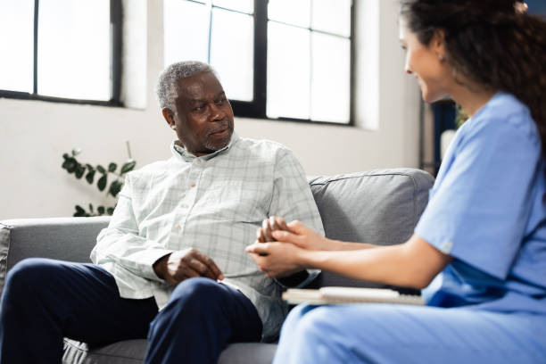 istock Gentle doctor helping a senior patient 2164285163