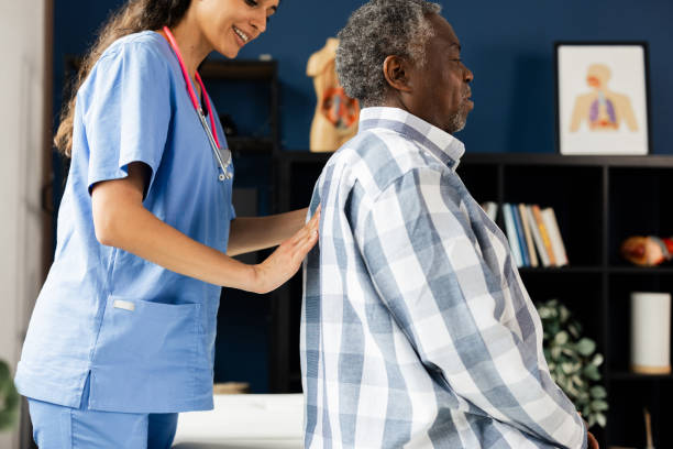 istock Senior man with back pain having a medical checkup 2164285194
