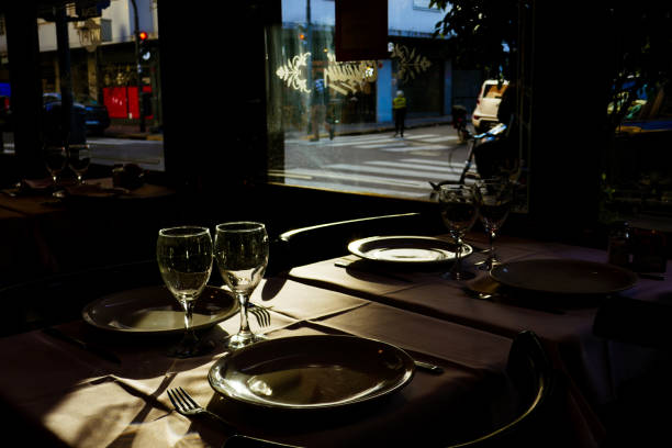 istock glasses and plates on a restaurant table 2164286870