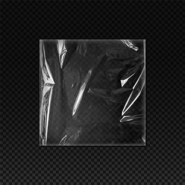 istock Vector overlay of transparent crumpled plastic bag on isolated black background 2164291395