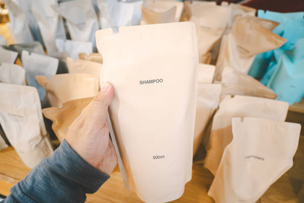 istock Hand holding Refill packet. Zero waste. Reuse reduce recycle concept. refill liquid soap, shampoo and other products. Plastic packaging for refill pouch in store. 2164292942