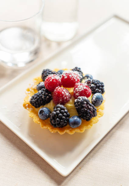 Dessert tart with raspberries, blackberries and blueberries