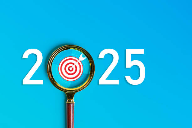 istock Magnifying glass shows target 2025, action business plan for the new year 2164299236