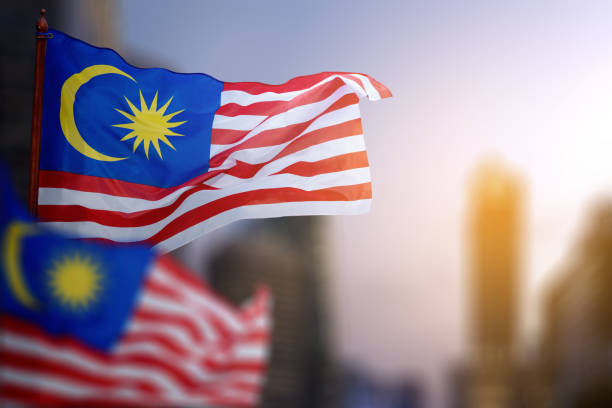istock A Malaysia flag with a blue star and red stripes is flying 2164305462
