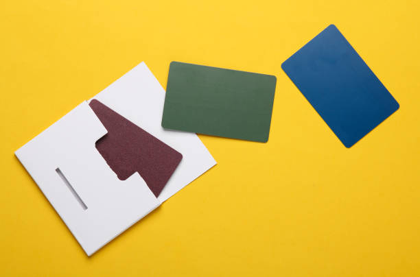 istock New Plastic Bank cards in white blank box on yellow background 2164305941