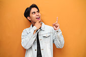 wow-face-young-asian-man-pointing-to-open-space-happy-excited-young-asian-man-posing-pointing.jpg?b=1&s=170x170&k=20&c=t5A5JBM-AoTdDzFH0iNvXGD138174Ip6QZX460bUinQ=