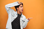 wow-face-young-asian-man-pointing-to-open-space-happy-excited-young-asian-man-posing-pointing.jpg?b=1&s=170x170&k=20&c=DZt7MqEl86ChW4knlxcHYPDSB0uynNiah4nnPvVZ2-g=