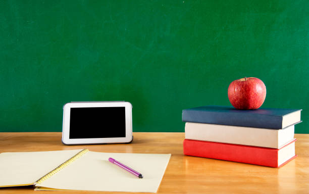 istock Back to school with apple, book and tablet 2164310815