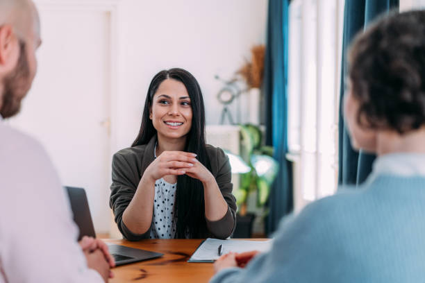istock Group of business persons talking in the office. 2164312397
