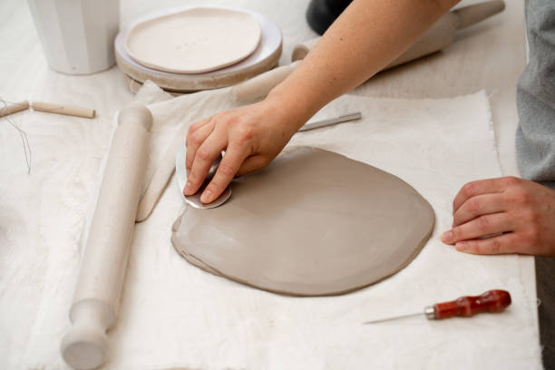 istock Preventing clay bodies from cracks by wedging. Making pliable clay without air pockets. Removing air bubbles from clay before hand building. 2164313844