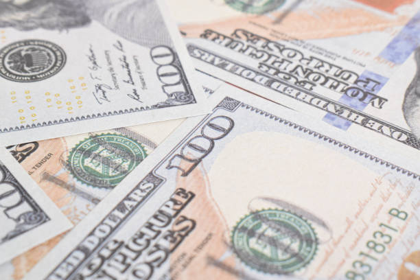istock Background of US dollar bills. Selective focus 2164315977