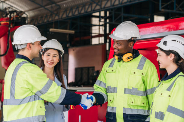 istock A group of construction workers shake hands. Worker industry join hand for collaboration. 2164316004
