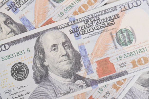 istock Background of US dollar bills. Top view 2164316178