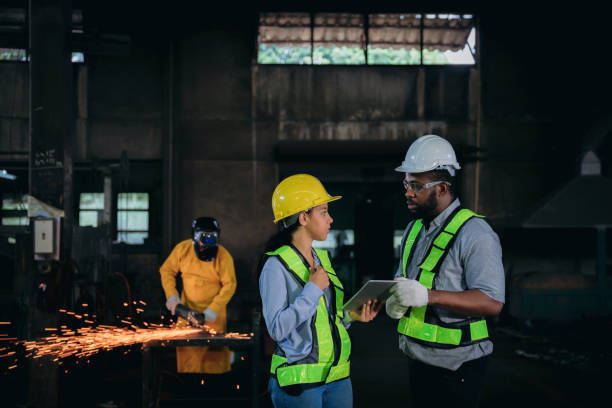 istock A group of workers wearing safety gear 2164316875