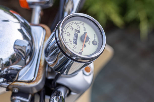 Back and white closeup motorcycle dashboard and handlebar, background with copy space, full frame horizontal composition
