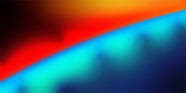 istock Vivid Gradient Spectrum Grainy Background. Noise texture background with deep blues, vibrant reds, warm yellows 2164317517