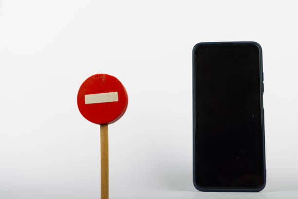 istock Wooden Prohibition Sign with Mobile Device 2164323884
