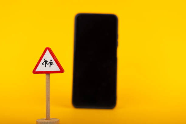 istock Caution Children with Smartphone in Background 2164323990