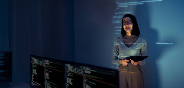 istock asian woman programmer standing in front of a screen with code projected  presentation the integration of technology and human expertise in software development 2164324217
