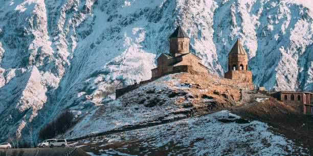 Stepantsminda, Georgia. Famous Gergeti Trinity Tsminda Sameba Church In Early Winter