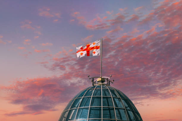 Tbilisi, Georgia. Flag Of Georgia, Five Cross Flag, Waving On Flagpole On Presidential Administration Palace, Avlabari Residence Roof. Close Up Tbilisi, Georgia. Flag Of Georgia, Five Cross Flag, Waving On Flagpole On Presidential Administration Palace, Avlabari Residence Roof. Close Up. georgia flag country stock pictures, royalty-free photos & images