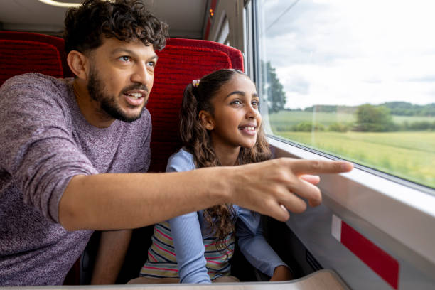 istock Father Pointing to the View from the Train 2164325638