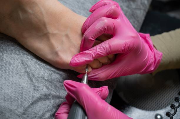 istock The master makes hardware pedicures to the client. Cuticle treatment. 2164327296