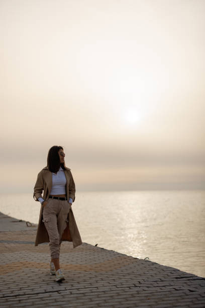 istock Enjoying autumn sunset above the sea 2164327514