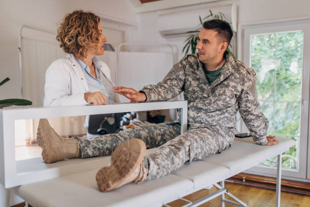 istock Military Veteran Amputee Experiencing Mirror Therapy for Phantom Pain Relief 2164330098