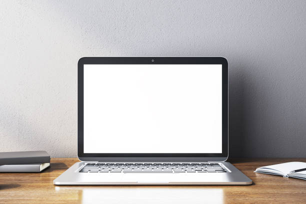 istock Modern laptop with blank screen on wooden desk in a clean workspace. 3D Rendering 2164331448