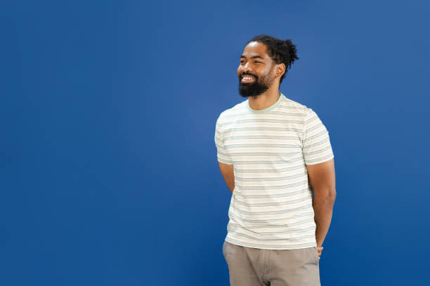 istock Smiling African American man captured in a studio setting 2164332744