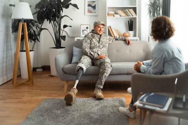istock Veteran with a prosthetic leg and therapist in a supportive conversation 2164332855
