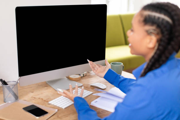 istock Confused black female student looking at blank computer screen 2164333804