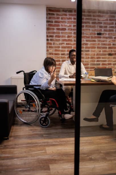 istock Coworkers talking in the office 2164336877