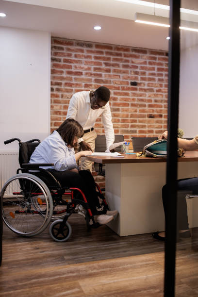 istock Coworkers talking in the office 2164336881