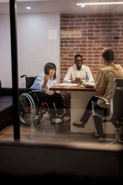 istock Coworkers talking in the office 2164337010