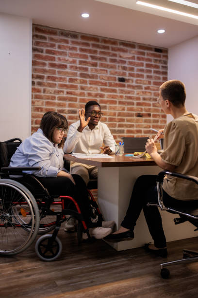 istock Coworkers talking in the office 2164337058