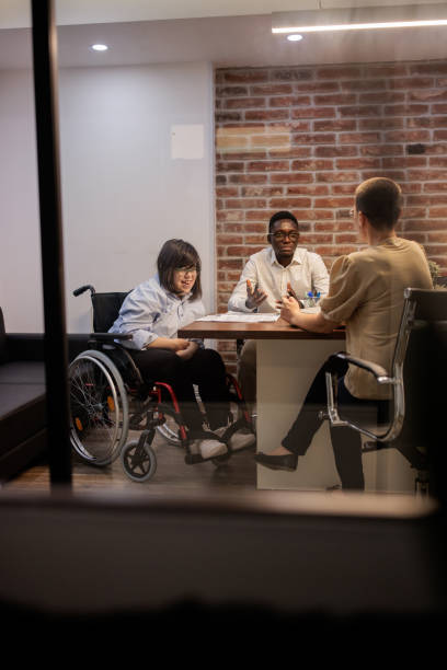 istock Coworkers talking in the office 2164337126