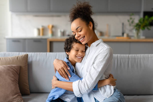 istock Affectionate mother and son hugging warmly in cozy home setting 2164339075