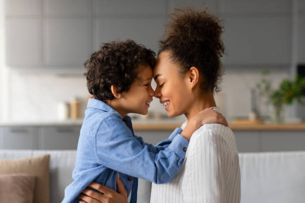 istock Loving moment as black mother and son share tender forehead touch 2164339166
