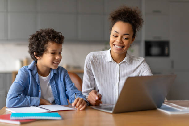 istock Mom and son working together on laptop 2164339208