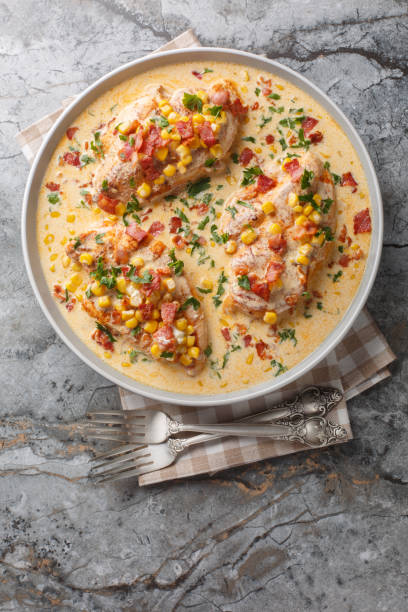 istock Creamy Chicken Corn and bacon closeup on the plate. Vertical top view 2164340964