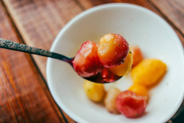 Tropical fruit Malpighia glabra (red acerola) in bowl. Selective focus